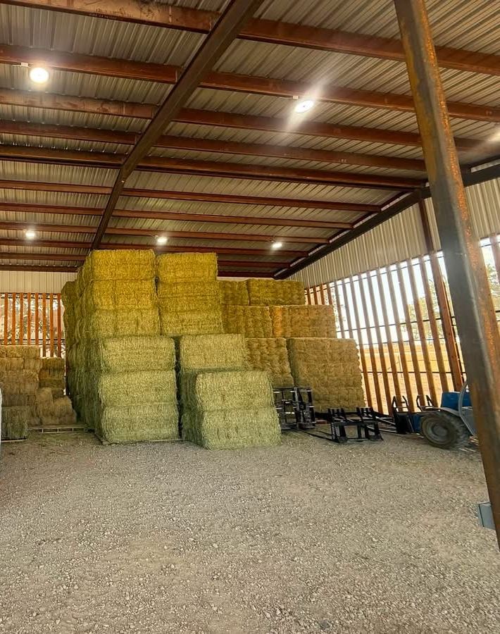 Hay stacked under roof in the barn